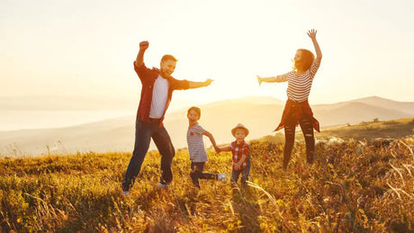 A joyous family in the setting sun